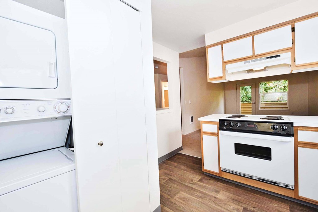 a comparison of a kitchen with a stove and a microwave